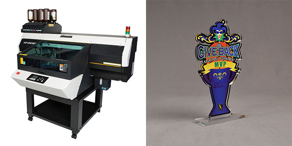 Mimaki ultraviolet direct printer with a full color printed acrylic award to the right.
